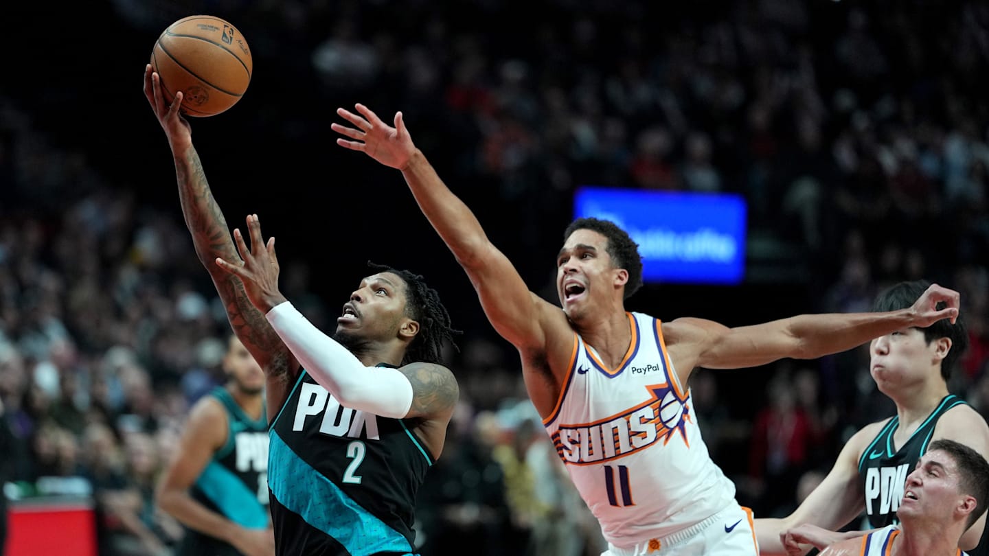 Nov 18, 2025; Portland, Oregon, USA; Portland Trail Blazers guard Caleb Love (2) drives to the basket past Phoenix Suns forward Oso Ighodaro (11) during the first half at Moda Center. Mandatory Credit: Soobum Im-Imagn Images