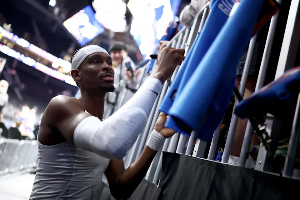 CHARLOTTE, NORTH CAROLINA - NOVEMBER 15: Shai Gilgeous-Alexander #2 of the Oklahoma City Thunder signs autographs prior to the game against the Charlotte Hornets at Spectrum Center on November 15, 2025 in Charlotte, North Carolina. NOTE TO USER: User expressly acknowledges and agrees that, by downloading and or using this photograph, User is consenting to the terms and conditions of the Getty Images License Agreement. (Photo by Jared C. Tilton/Getty Images)