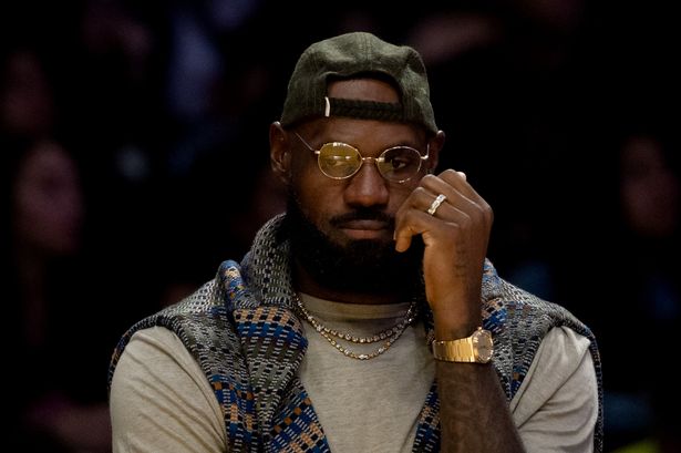 Los Angeles Lakers forward LeBron James (23) sits on the bench during the first half of an NBA basketball game against the Miami Heat at Crypto.com Arena on Sunday, Nov. 2, 2025 in Los Angeles, CA