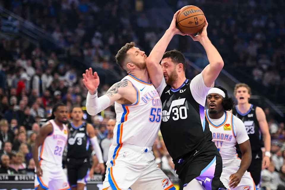 SALT LAKE CITY, UTAH - NOVEMBER 21: Jusuf Nurkic #30 of the Utah Jazz drives into Isaiah Hartenstein #55 of the Oklahoma City Thunder during the first half of a 2025-26 Emirates Cup game at Delta Center on November 21, 2025 in Salt Lake City, Utah. NOTE TO USER: User expressly acknowledges and agrees that, by downloading and or using this photograph, User is consenting to the terms and conditions of the Getty Images License Agreement. (Photo by Alex Goodlett/Getty Images)