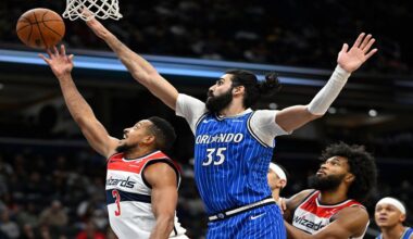 Washington Wizards guard CJ McCollum (3) attempts a shot against Orlando Magic center Goga Bitadze (35) during the first half of an NBA basketball game, Saturday, Nov. 1, 2025, in Washington. (AP Photo/John McDonnell)