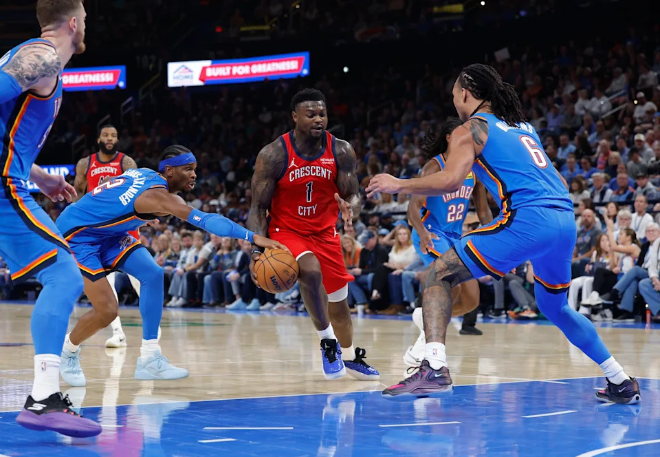 Nov 2, 2025; Oklahoma City, Oklahoma, USA; New Orleans Pelicans forward Zion Williamson (1) drives to the basket between Oklahoma City Thunder guard Shai Gilgeous-Alexander (2) and forward Jaylin Williams (6) during the second half at Paycom Center. Mandatory Credit: Alonzo Adams-Imagn Images