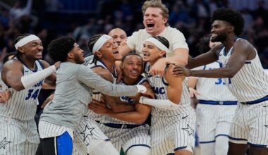 Orlando Magic guard Desmond Bane, center, celebrates with teammates after making a game winning shot against the Portland Trail Blazers at the buzzer in an NBA basketball game, Monday, Nov. 10, 2025, in Orlando, Fla. (AP Photo/John Raoux)