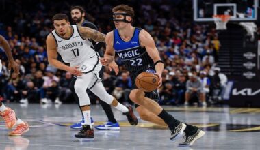Orlando Magic forward Franz Wagner (22) drives against Brooklyn Nets forward Michael Porter Jr. (17) during the second half of an NBA Cup basketball game, Friday, Nov. 14, 2025, in Orlando, Fla. (AP Photo/Kevin Kolczynski)