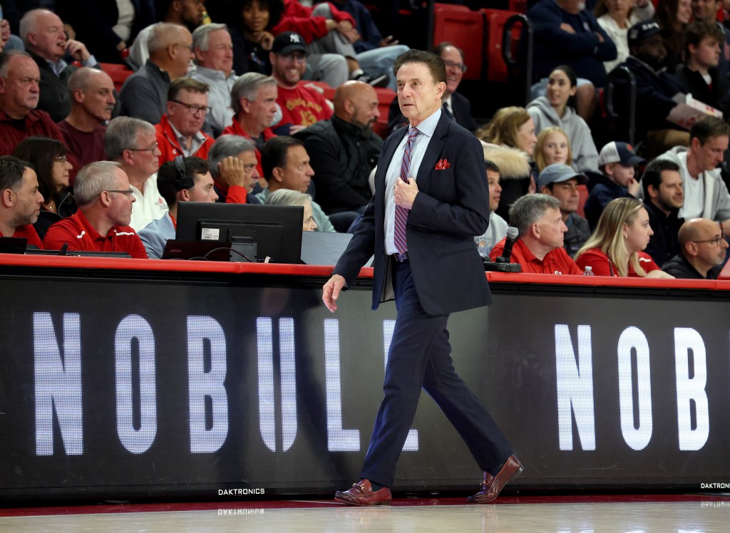 St. John's Red Storm head coach Rick Pitino on the baseline.