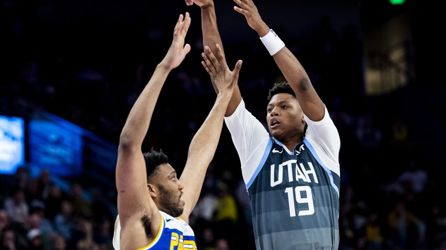 Utah Jazz forward Ace Bailey (19) holds his follow through on his shot while guarded by Indiana Pac...