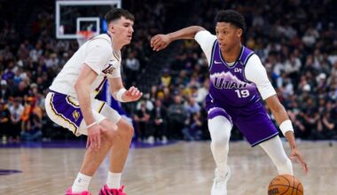 Utah Jazz guard Ace Bailey (19) drives to the basket against Los Angeles Lakers forward Jake LaRavi...