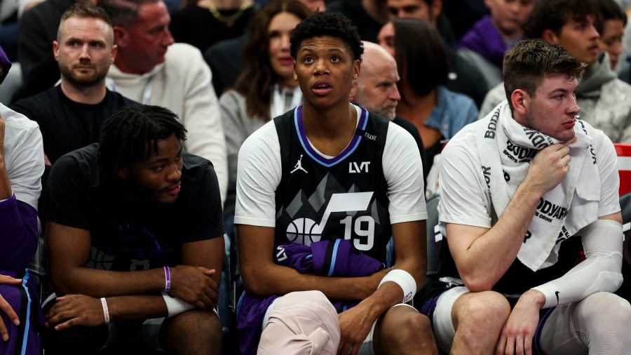 Utah Jazz guard Ace Bailey (19) sits on the bench with a wrap on his right knee after getting injur...