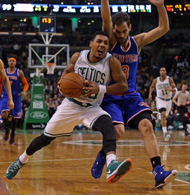 ( Boston, MA,12/12/14) Boston Celtics guard Phil Pressey (26) is pressured by New York Knicks guard Jose Calderon (3) as the Celtics take on the Knicks at the Garden. Friday, December 12, 2014. (Staff photo by Stuart Cahill)