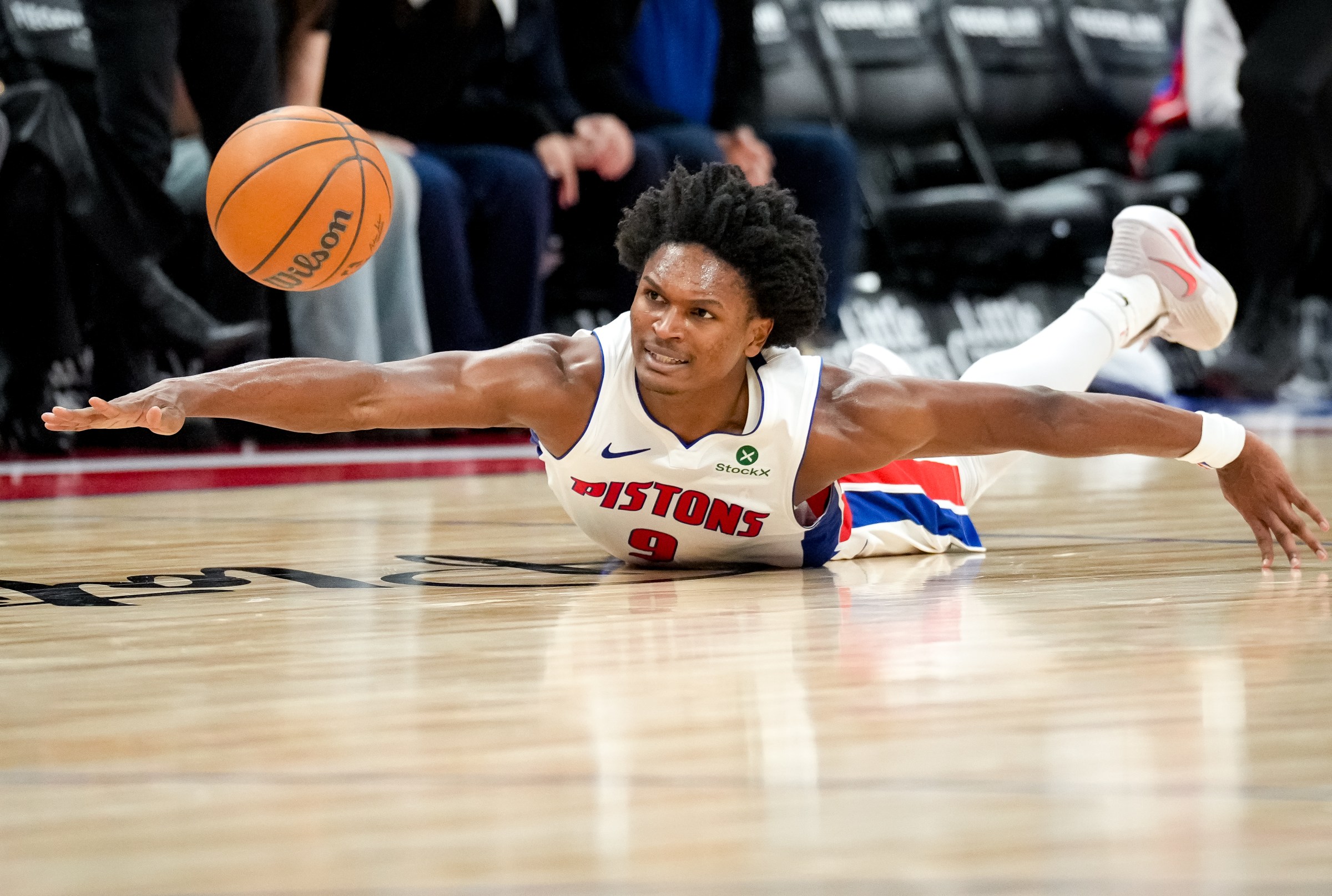 DETROIT, MICHIGAN - OCTOBER 26: Ausar Thompson #9 of the Detroit Pistons dives for the ball against the Boston Celtics during the third quarter at Little Caesars Arena on October 26, 2025 in Detroit, Michigan. NOTE TO USER: User expressly acknowledges and agrees that, by downloading and or using this photograph, User is consenting to the terms and conditions of the Getty Images License Agreement. (Photo by Nic Antaya/Getty Images)