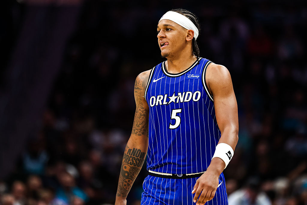 CHARLOTTE, NORTH CAROLINA - OCTOBER 30: Paolo Banchero #5 of the Orlando Magic looks on during the first half of a basketball game against the Charlotte Hornets at Spectrum Center on October 30, 2025 in Charlotte, North Carolina. NOTE TO USER: User expressly acknowledges and agrees that, by downloading and or using this photograph, User is consenting to the terms and conditions of the Getty Images License Agreement. (Photo by David Jensen/Getty Images)