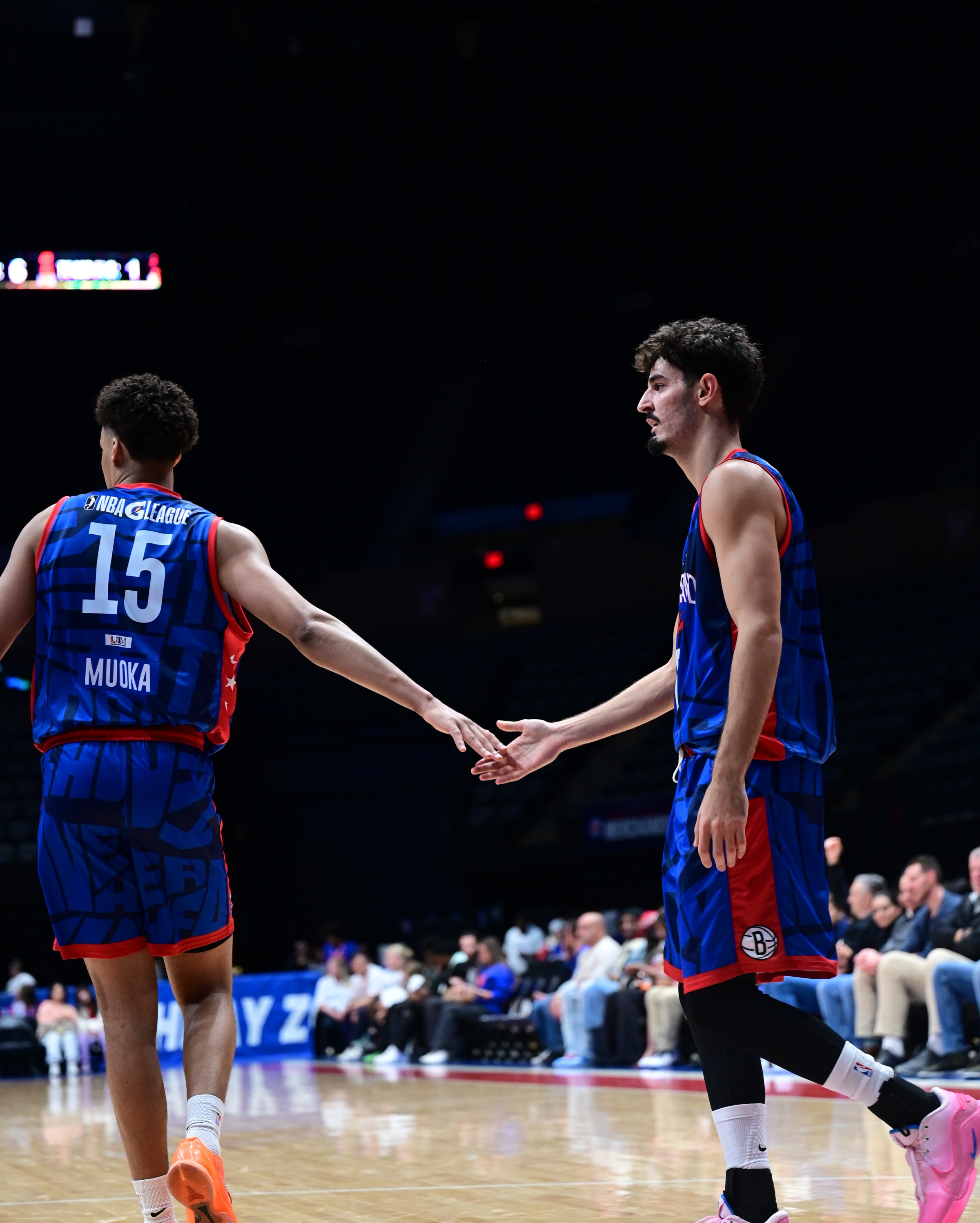 UNIONDALE, NY - NOVEMBER 7: Ben Saraf #77 and David Muoka #15 of the Long Island Nets high five during the game against the Capital City Go-Go on November 7, 2025 at The Nassau Veterans Memorial Coliseum in Uniondale, New York. NOTE TO USER: User expressly acknowledges and agrees that, by downloading and or using this Photograph, User is consenting to the terms and conditions of the Getty Images License Agreement. Mandatory Copyright Notice: Copyright 2025 NBAE (Photo by Matthew Benavides/NBAE via Getty Images)