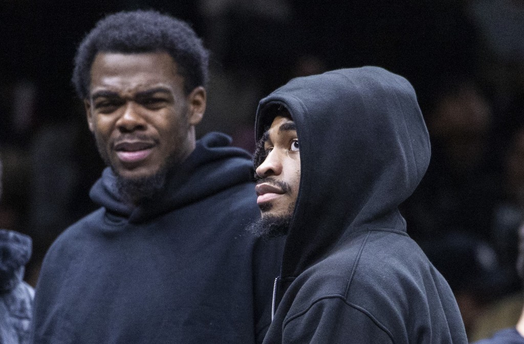 Day'Ron Sharpe (left) and Cam Thomas, who did not play because of injuries, look on during the Nets' 119-109 loss to the Raptors on Nov. 11, 2025.