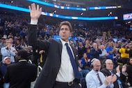 FILE - Former Golden State Warriors general manager Bob Myers waves while being honored...