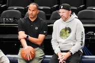 Former Dallas Mavericks general manager Nico Harrison (center) talks with head coach Jason...