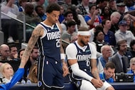 Dallas Mavericks forward P.J. Washington (25) and center Daniel Gafford (21), wait to check...