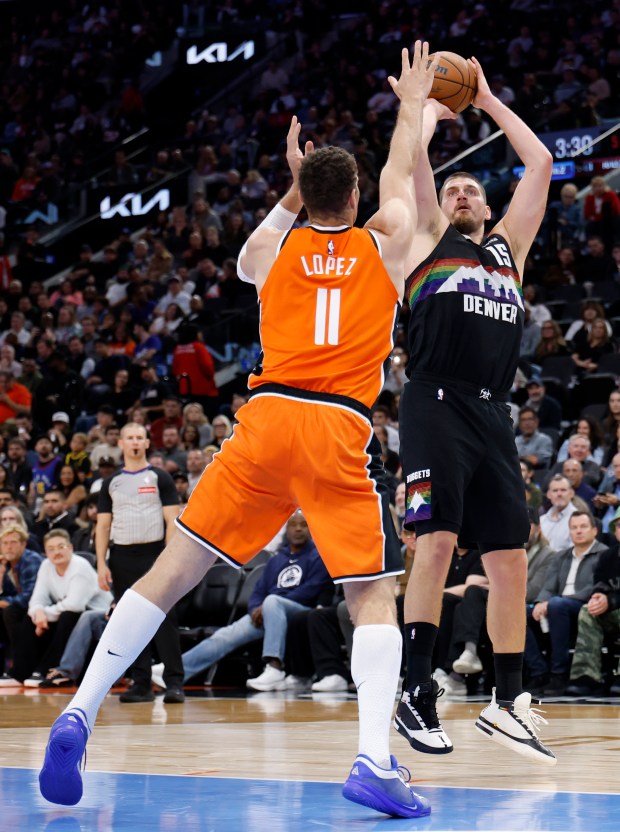 Denver Nuggets center Nikola Jokic shoots a fadeaway jumper in...