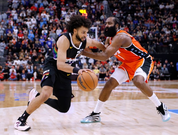 Denver Nuggets guard Jamal Murray drives to the basket as...