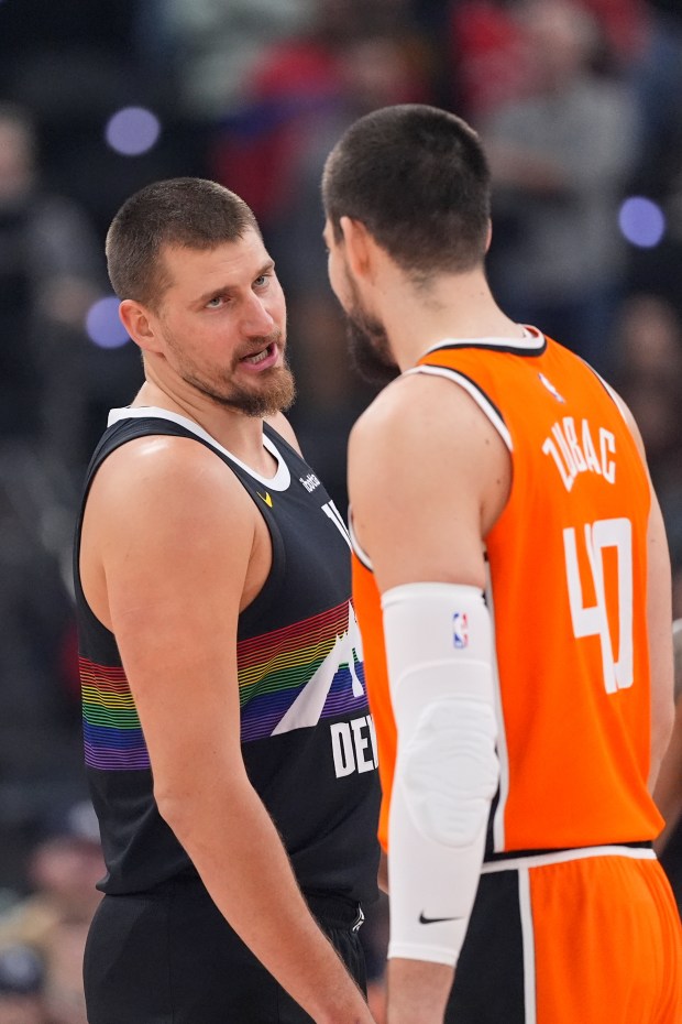 Denver Nuggets center Nikola Jokic, left, and Clippers center Ivica...