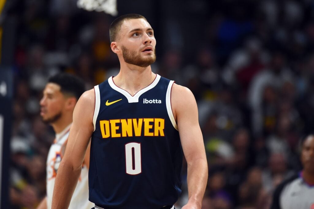 Oct 25, 2025; Denver, Colorado, USA; Denver Nuggets guard Christian Braun (0) walks back to the bench after a play during the first half against the Phoenix Suns at Ball Arena. Mandatory Credit: Christopher Hanewinckel-Imagn Images