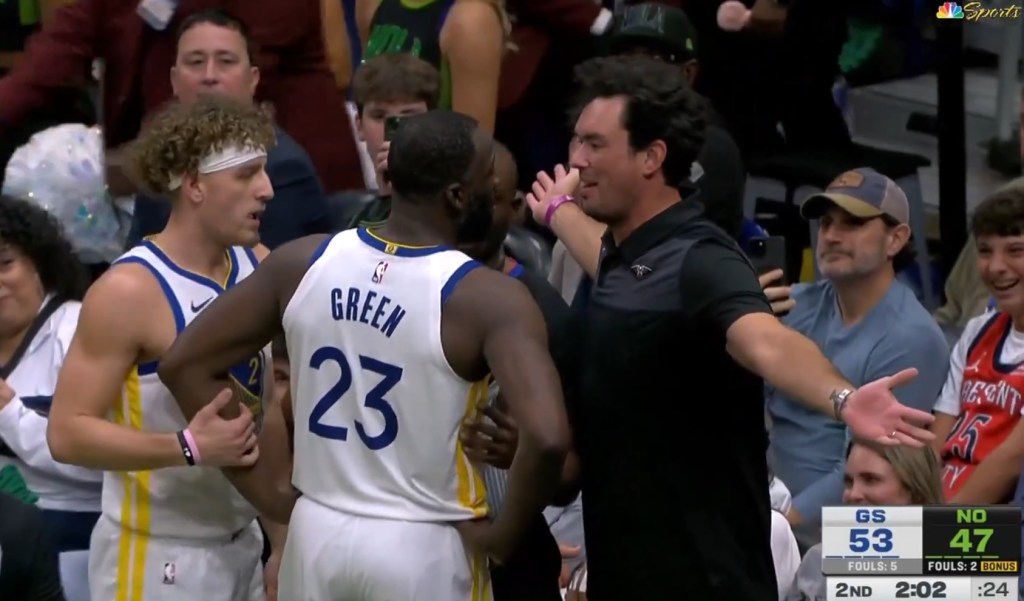 Draymond Green (23) of the Warriors confronts Pelicans fan Sam Green (r.) during the second quarter in New Orleans on Nov. 16, 2025.