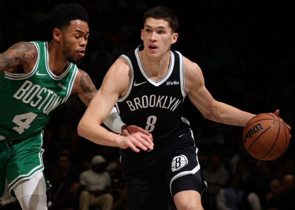 Egor Dëmin drives on Jrue Holiday during the Nets-Celtics game on Nov. 18, 2025.