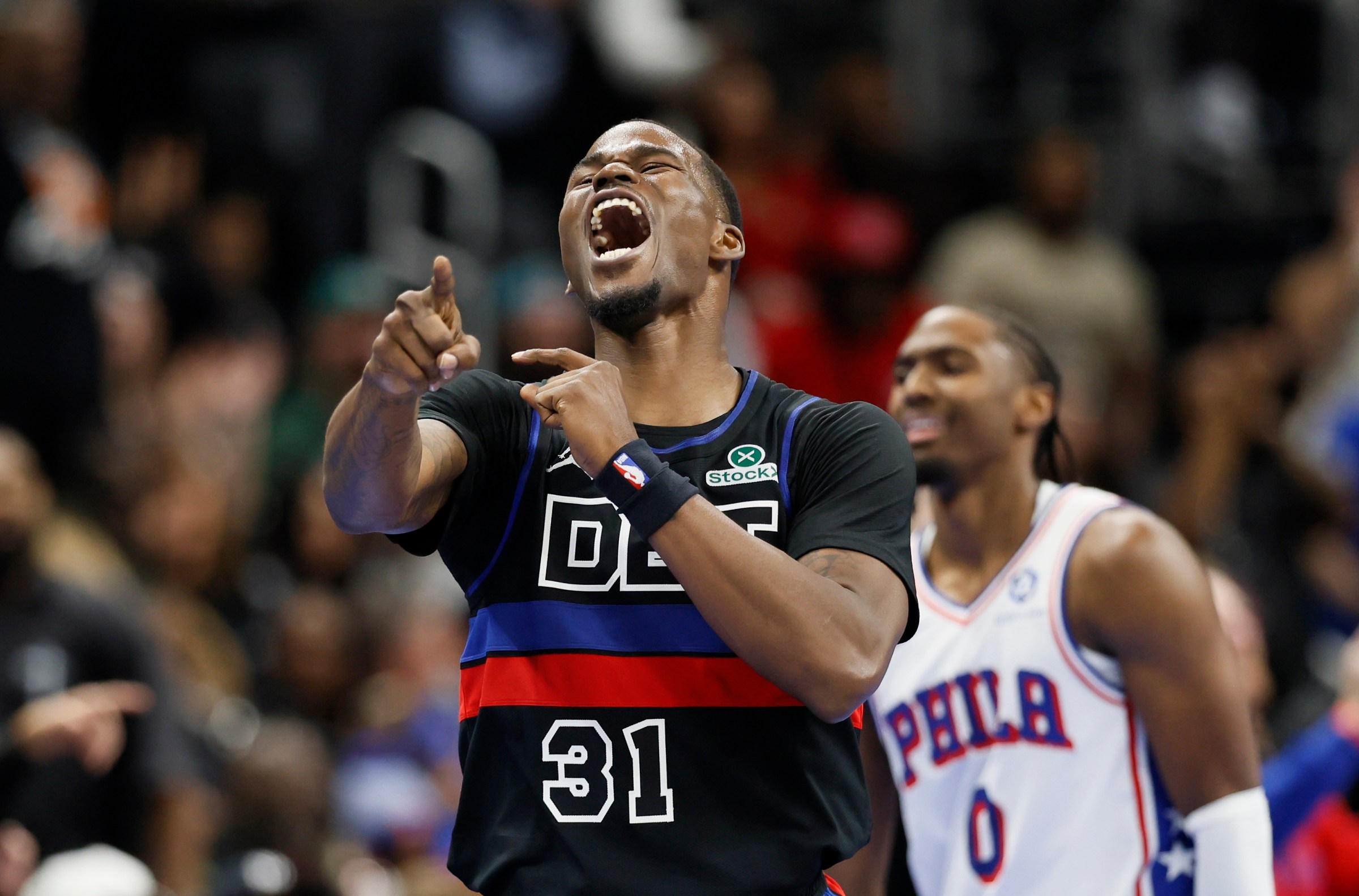 DETROIT, MICHIGAN - NOVEMBER 14: Javonte Green #31 of the Detroit Pistons celebrates in the front of Tyrese Maxey #0 of the Philadelphia 76ers after the 76ers turned over the ball during the fourth quarter of the Pistons’ 114-105 win at Little Caesars Arena on November 14, 2025 in Detroit, Michigan. NOTE TO USER: User expressly acknowledges and agrees that, by downloading and or using this photograph, User is consenting to the terms and conditions of the Getty Images License Agreement. (Photo by Duane Burleson/Getty Images)