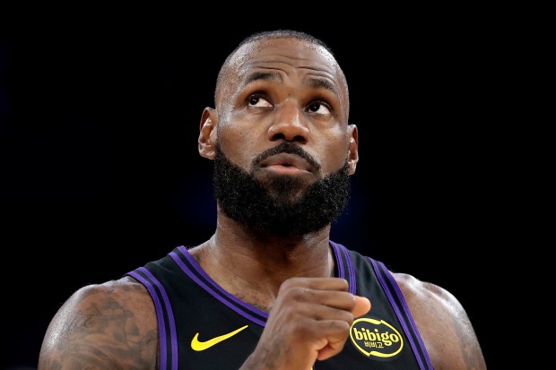 Lakers star LeBron James looks on during the first half...