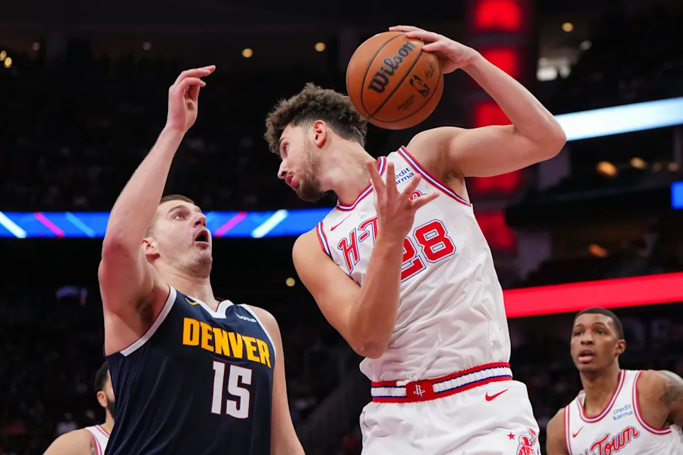 HOUSTON, TEXAS - NOVEMBER 24: Alperen Sengun #28 of the Houston Rockets grabs a rebound as Nikola Jokic #15 of the Denver Nuggets defends in the second quarter of an NBA In-Season Tournament game at Toyota Center on November 24, 2023 in Houston, Texas. NOTE TO USER: User expressly acknowledges and agrees that, by downloading and or using this photograph, User is consenting to the terms and conditions of the Getty Images License Agreement. (Photo by Alex Bierens de Haan/Getty Images)