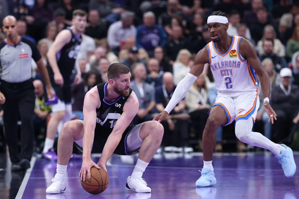 Nov 21, 2025; Salt Lake City, Utah, USA; Utah Jazz guard Svi Mykhailiuk (10) controls the ball as Oklahoma City Thunder guard Shai Gilgeous-Alexander (2) defends during the first half at Delta Center. Mandatory Credit: Rob Gray-Imagn Images