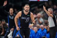 Dallas Mavericks guard Klay Thompson runs the court after scoring in the first half of an...