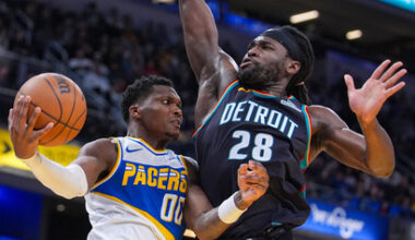 Indiana Pacers guard Bennedict Mathurin (00) makes a pass around Detroit Pistons forward Isaiah Stewart (28) during the second half of an NBA basketball game in Indianapolis, Monday, Nov. 24, 2025. (AP Photo/Michael Conroy)