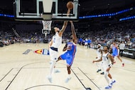 Dallas Mavericks center Dereck Lively II (2) blocks a shot by Oklahoma City Thunder guard...