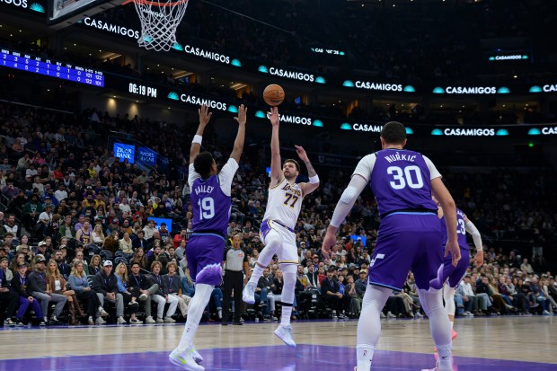 Lakers guard Luka Doncic (77) shoots the ball over Utah...