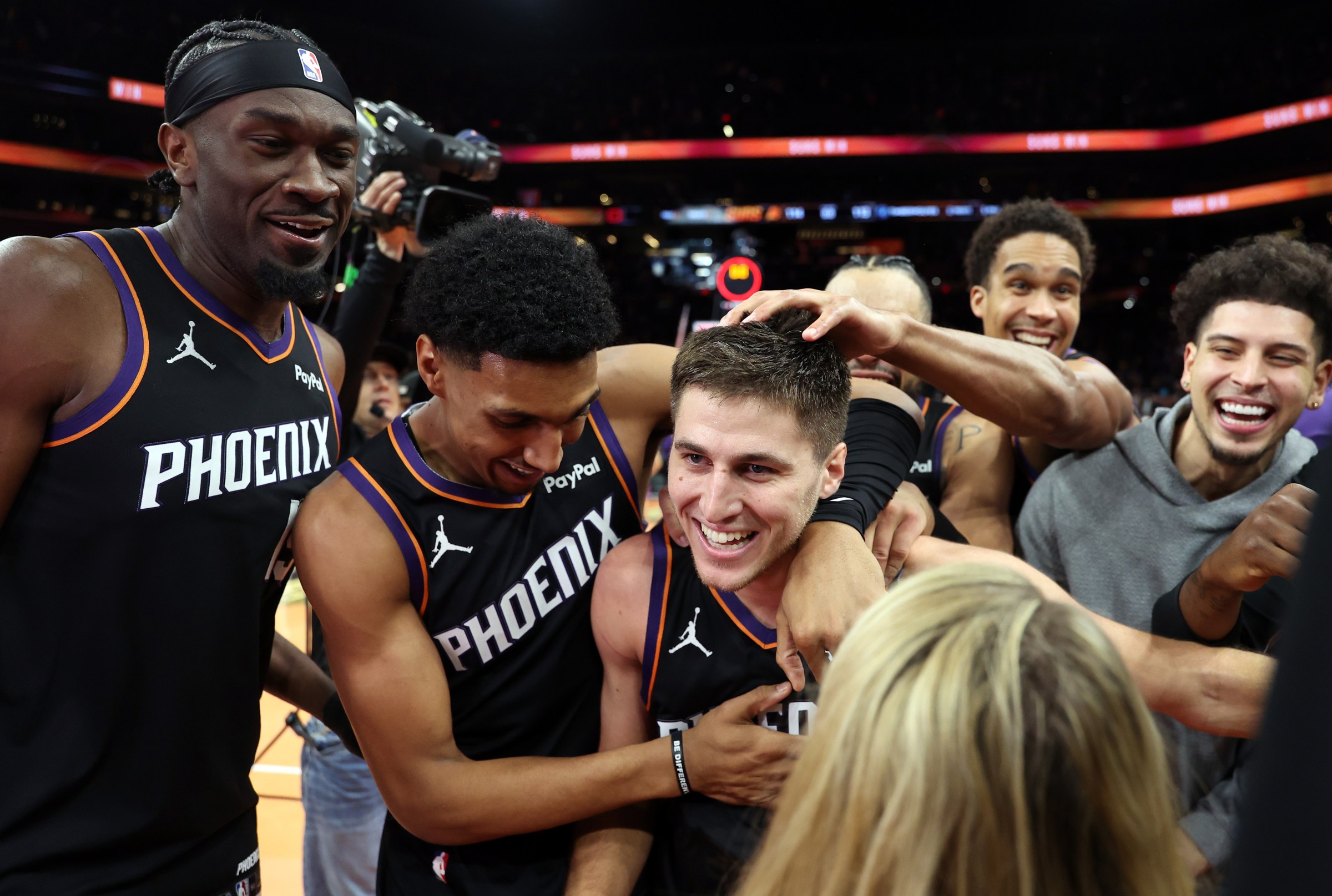 PHOENIX, ARIZONA - NOVEMBER 21: (L-R) Mark Williams #15, Ryan Dunn #0 and Collin Gillespie #12 of the Phoenix Suns celebrate after defeating the Minnesota Timberwolves 114-113 in an NBA Cup game at Mortgage Matchup Center on November 21, 2025 in Phoenix, Arizona. NOTE TO USER: User expressly acknowledges and agrees that, by downloading and or using this photograph, User is consenting to the terms and conditions of the Getty Images License Agreement. (Photo by Chris Coduto/Getty Images)