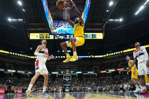 Indiana Pacers forward Isaiah Jackson dunks in front of Washington Wizards forward Tristan Vukcevic (00) during the first half of an NBA basketball game in Indianapolis, Friday, Nov. 28, 2025. (AP Photo/AJ Mast)