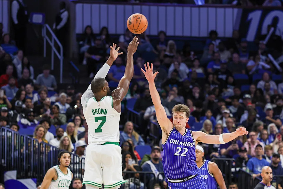 Nov 9, 2025; Orlando, Florida, USA; Boston Celtics guard Jaylen Brown (7) shoots over Orlando Magic forward Franz Wagner (22) during the second half at Kia Center. Mandatory Credit: Mike Watters-Imagn Images