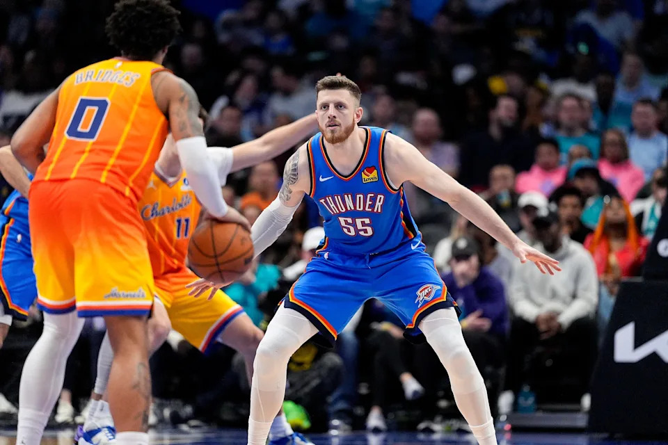 Nov 15, 2025; Charlotte, North Carolina, USA; Oklahoma City Thunder center Isaiah Hartenstein (55) back on defense against Charlotte Hornets forward Miles Bridges (0) during the second half at Spectrum Center. Mandatory Credit: Jim Dedmon-Imagn Images