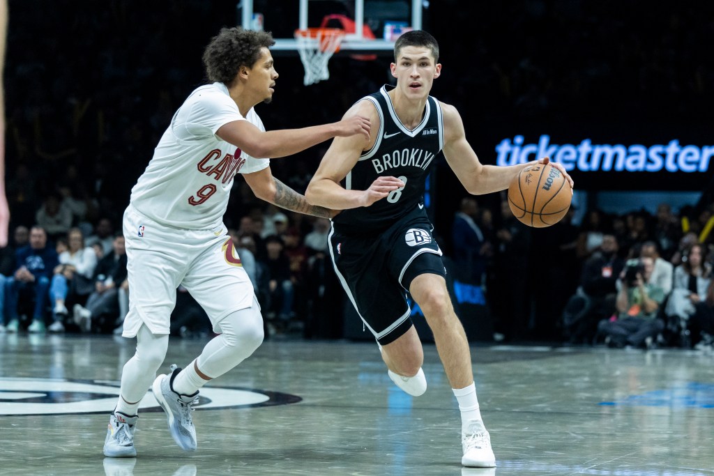 Brooklyn Nets guard Egor Demin (8) drives around Cleveland Cavaliers guard Craig Porter Jr. (9) in the second half at Barclays Center, Friday, Oct. 24, 2025, in Brooklyn, NY. 