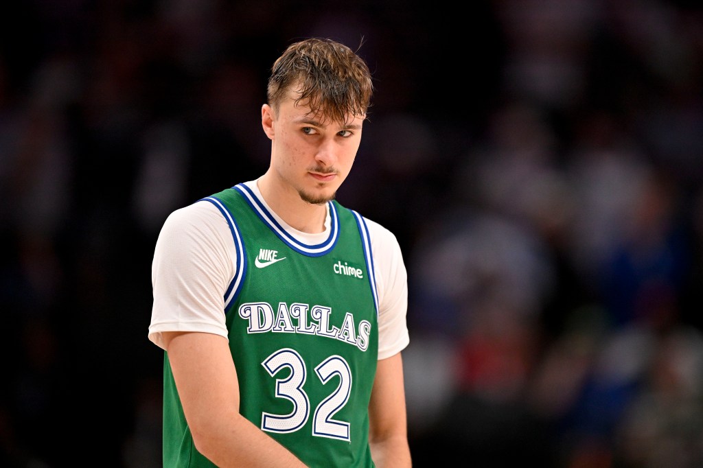 Dallas Mavericks player wearing a green number 32 jersey.