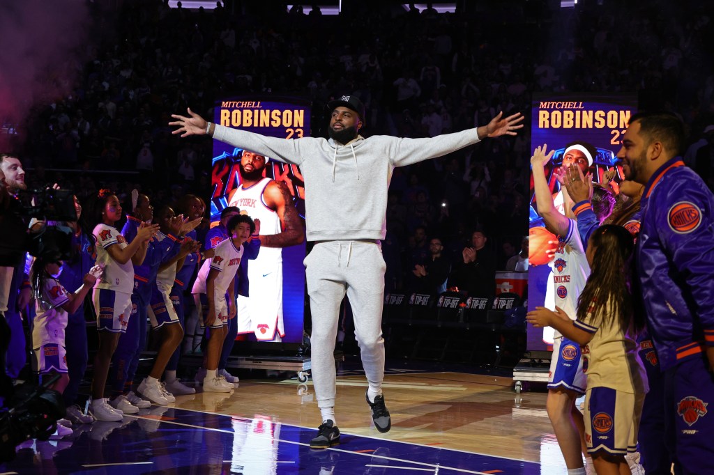 Mitchell Robinson #23 of the New York Knicks is introduced before the game against the Cleveland Cavaliers on October 22, 2025.