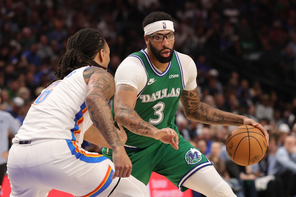 Anthony Davis #3 of the Dallas Mavericks is defended by Jaylin Williams #6 of the Oklahoma City Thunder during the second half at American Airlines Center on October 27, 2025 in Dallas, Texas.