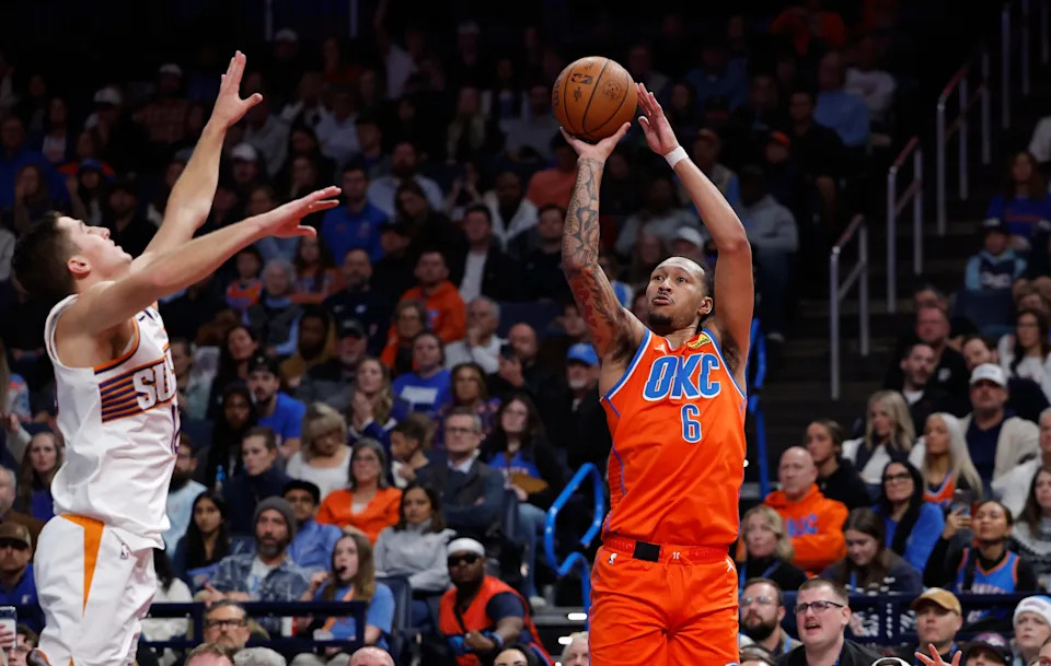 Nov 28, 2025; Oklahoma City, Oklahoma, USA; Oklahoma City Thunder forward Jaylin Williams (6) shoots a three point basket over Phoenix Suns guard Collin Gillespie (12) during the second half at Paycom Center. Mandatory Credit: Alonzo Adams-Imagn Images