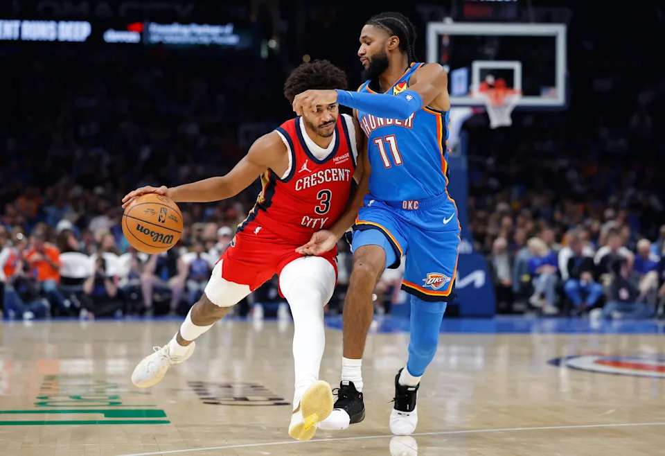 Nov 2, 2025; Oklahoma City, Oklahoma, USA; New Orleans Pelicans guard Jordan Poole (3) drives down the court as Oklahoma City Thunder guard Isaiah Joe (11) defends during the second half at Paycom Center. Mandatory Credit: Alonzo Adams-Imagn Images