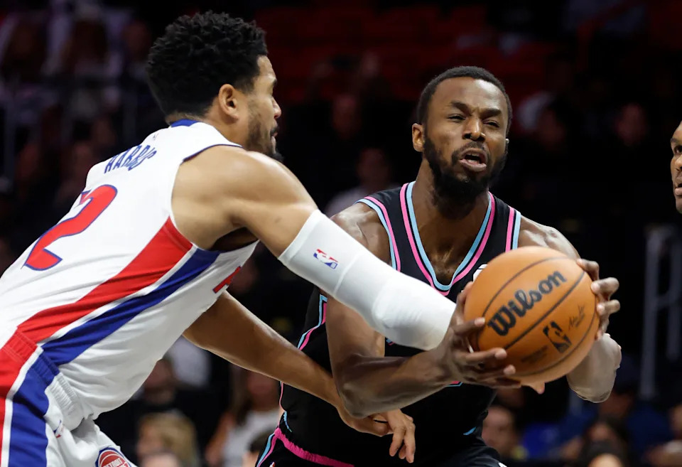 Detroit Pistons forward Tobias Harris (12) fouls Miami Heat forward Andrew Wiggins (22) during the first half at Kaseya Center in Miami on Saturday, Nov. 29, 2025.