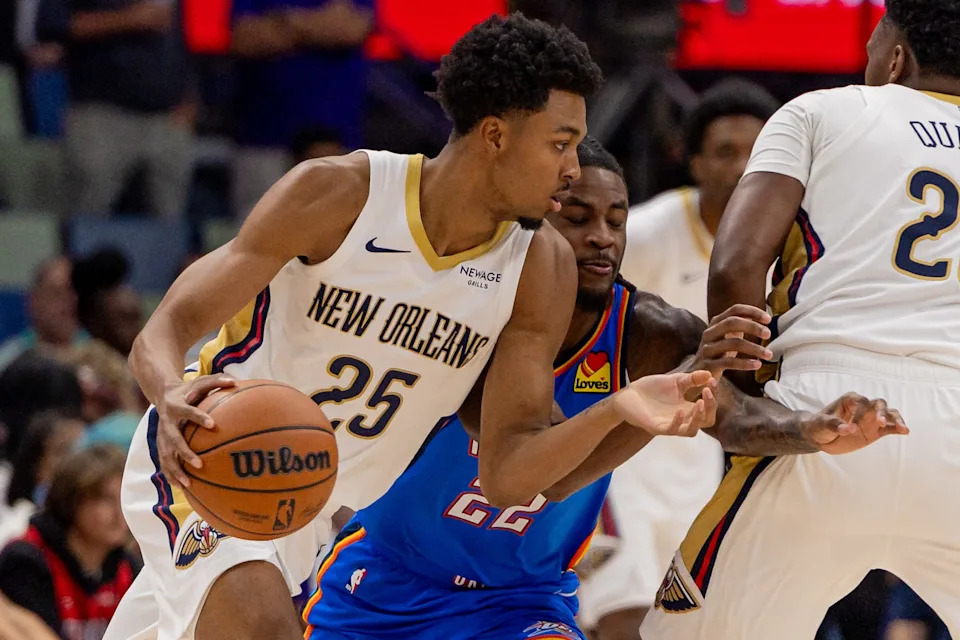 Nov 17, 2025; New Orleans, Louisiana, USA; New Orleans Pelicans forward Trey Murphy III (25) dribbles against Oklahoma City Thunder guard Cason Wallace (22) during the first half at Smoothie King Center. Mandatory Credit: Stephen Lew-Imagn Images