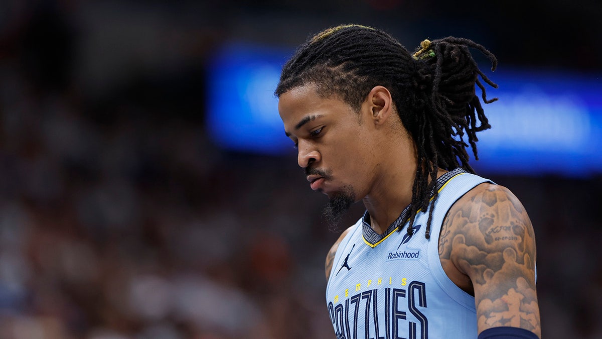 Ja Morant with head down on court