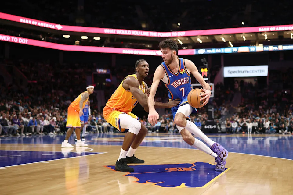 CHARLOTTE, NORTH CAROLINA - NOVEMBER 15: Chet Holmgren #7 of the Oklahoma City Thunder drives to the basket against Moussa Diabate #14 of the Charlotte Hornets during the second quarter of the game at Spectrum Center on November 15, 2025 in Charlotte, North Carolina. NOTE TO USER: User expressly acknowledges and agrees that, by downloading and or using this photograph, User is consenting to the terms and conditions of the Getty Images License Agreement. (Photo by Jared C. Tilton/Getty Images)