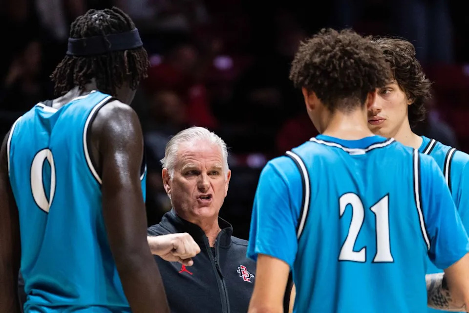 San Diego State Head Coach Brian Dutcher talks to San Diego State players during an NCAA Basketball game against Troy, Tuesday November 18, 2025 at Viejas Arena in San Diego, Calif.