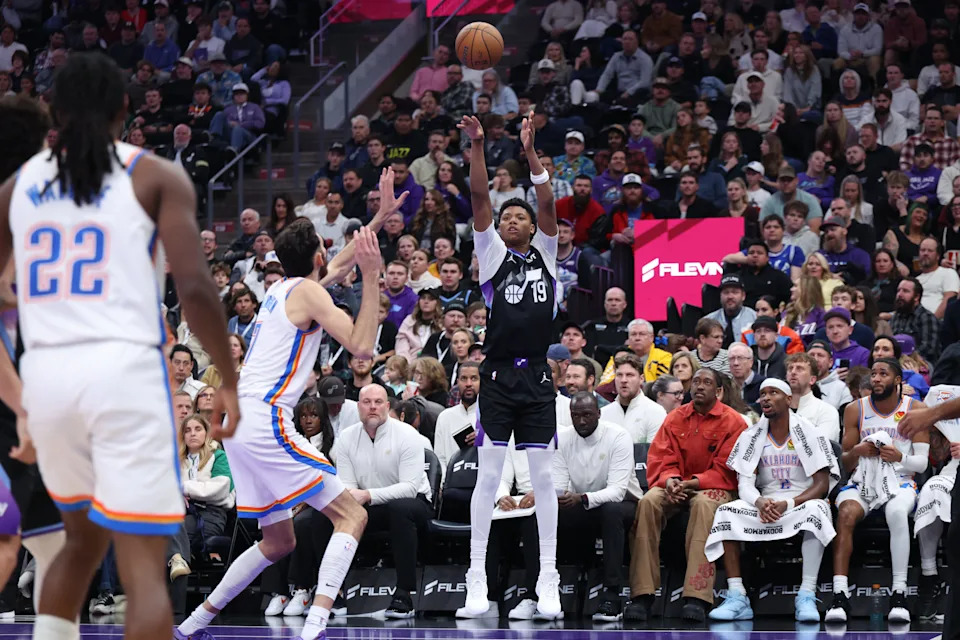 Nov 21, 2025; Salt Lake City, Utah, USA; Utah Jazz guard Ace Bailey (19) makes a three-point basket against the Oklahoma City Thunder during the second half at Delta Center. Mandatory Credit: Rob Gray-Imagn Images